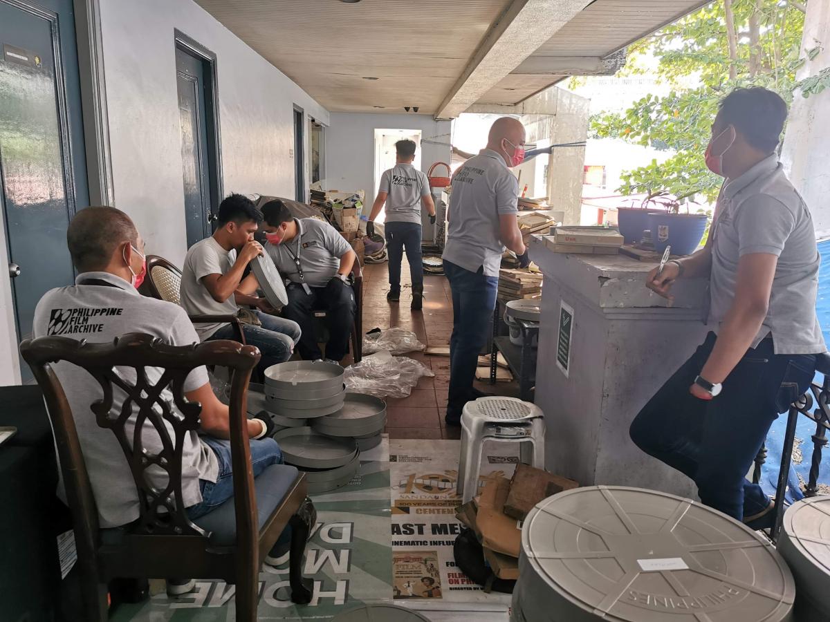 The PFA team transfers film reels from old to new cans